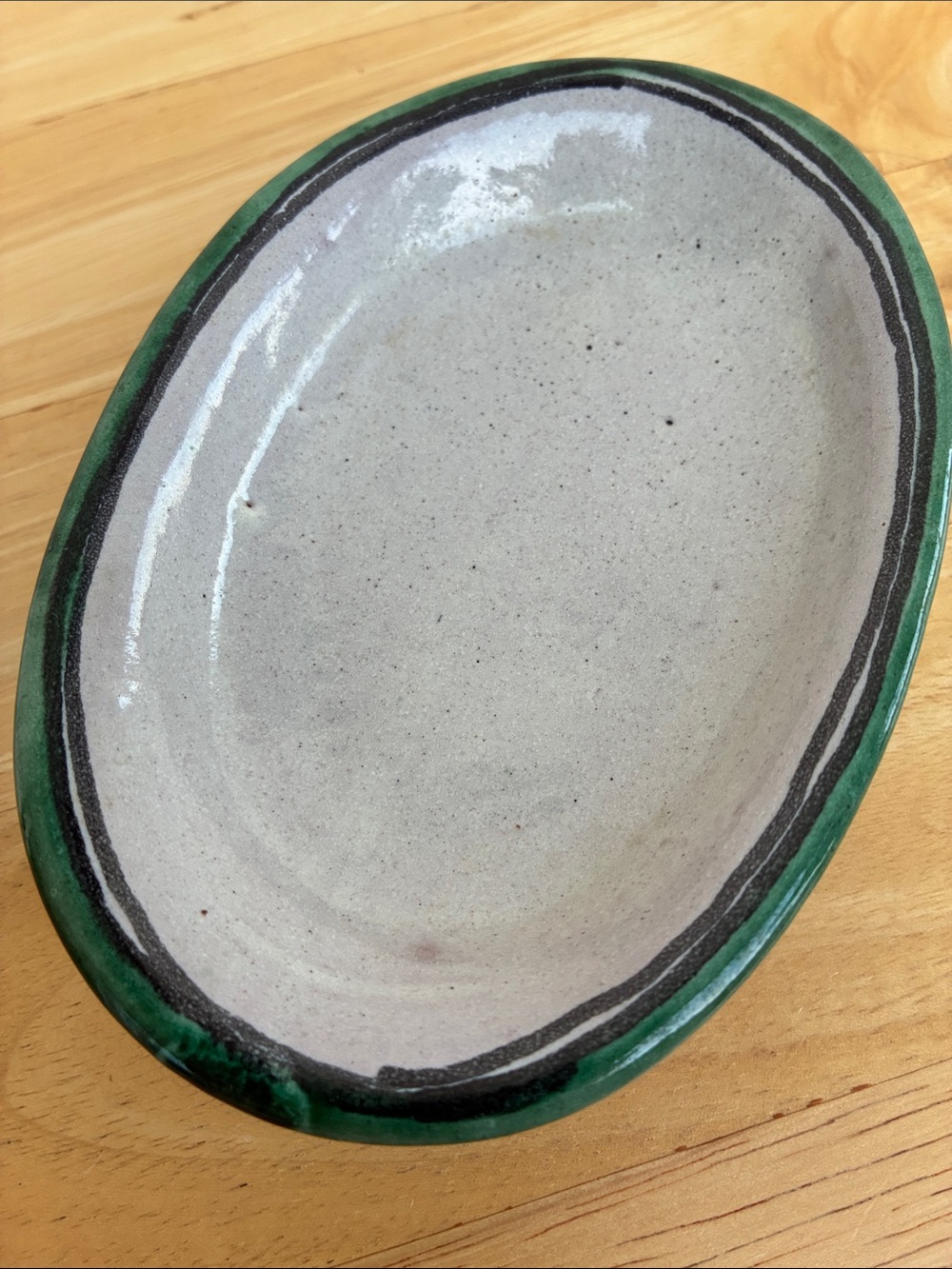Small handcrafted oval ceramic dish grey with green & black   signed